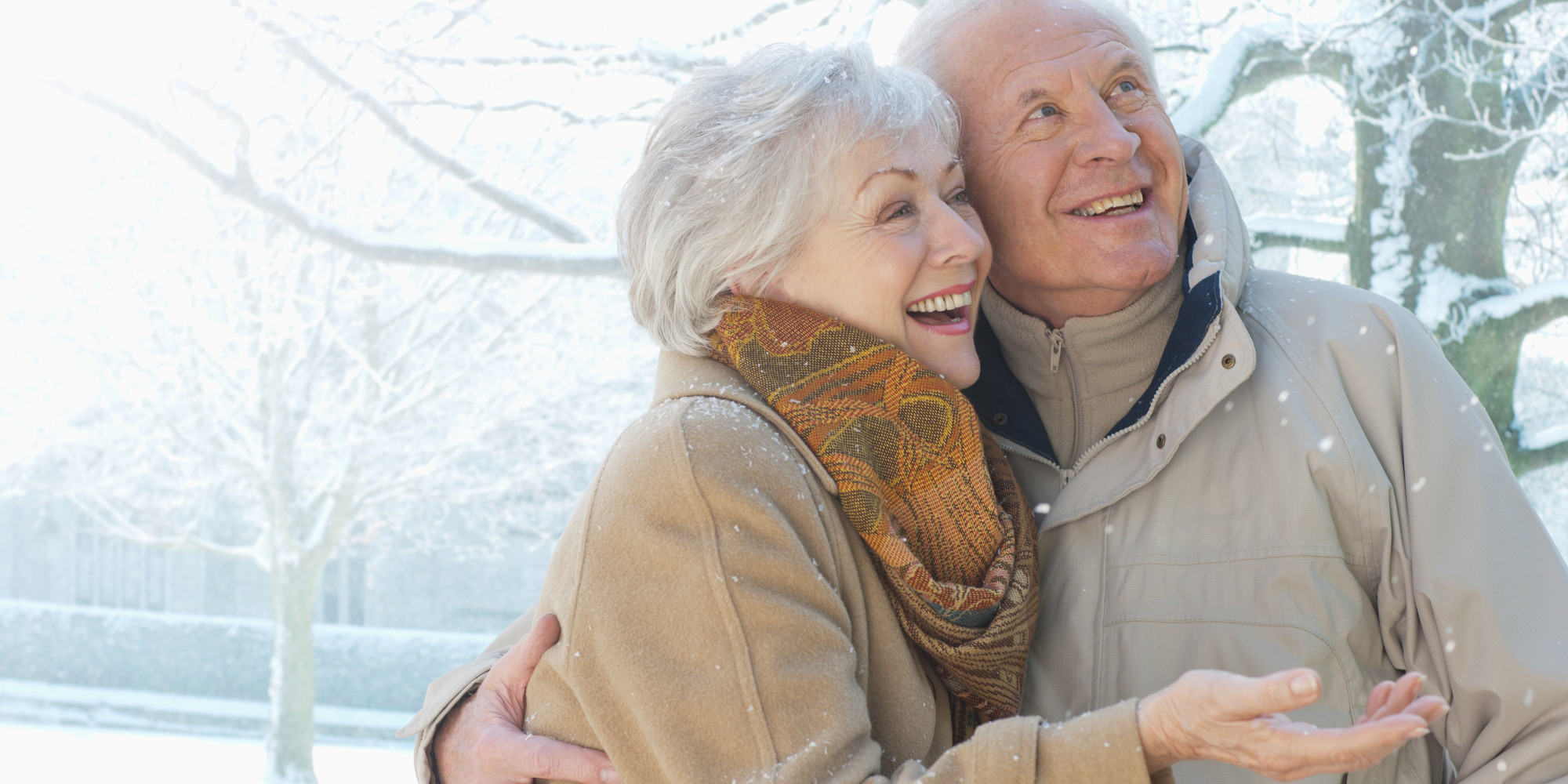 Couple smiling in snow