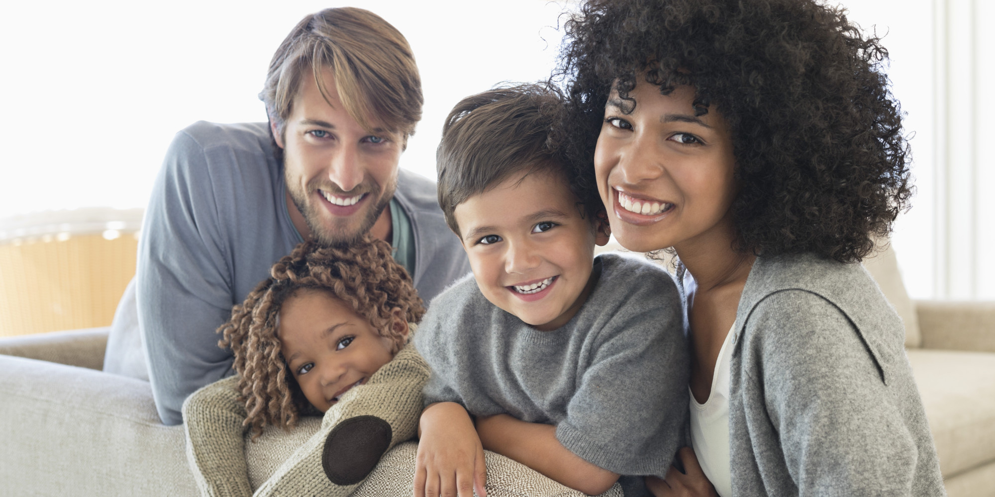 Portrait of a couple smiling with their children