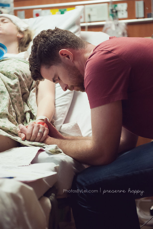 This father is praying that his baby will arrive safely.