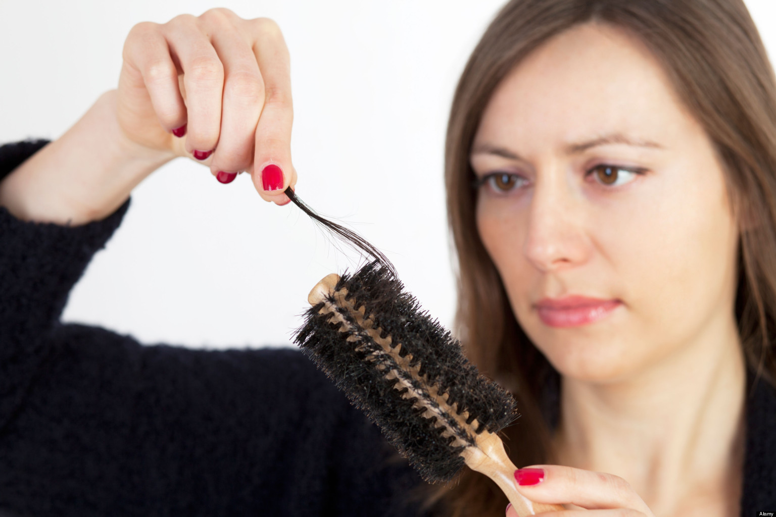 CC236P Dark-haired woman being sad, because of having problems with hair loss