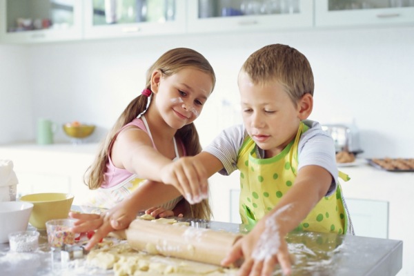 Children making biscuits --- Image by ?? Royalty-Free/Corbis