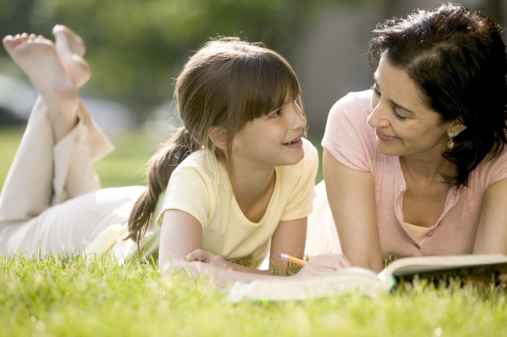 Mother Helping Daughter with Her Homework.